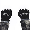 BUNKR Gloves worn as fists, BUNKR logo on the back of both hands