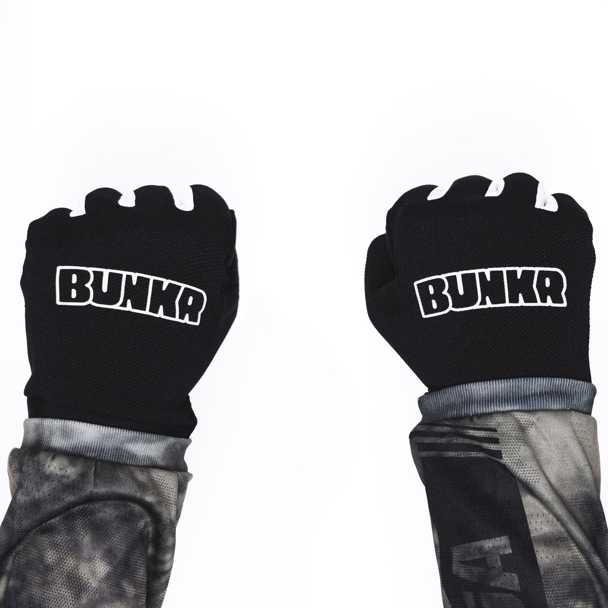 BUNKR Gloves worn as fists, BUNKR logo on the back of both hands