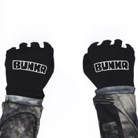 BUNKR Gloves worn as fists, BUNKR logo on the back of both hands